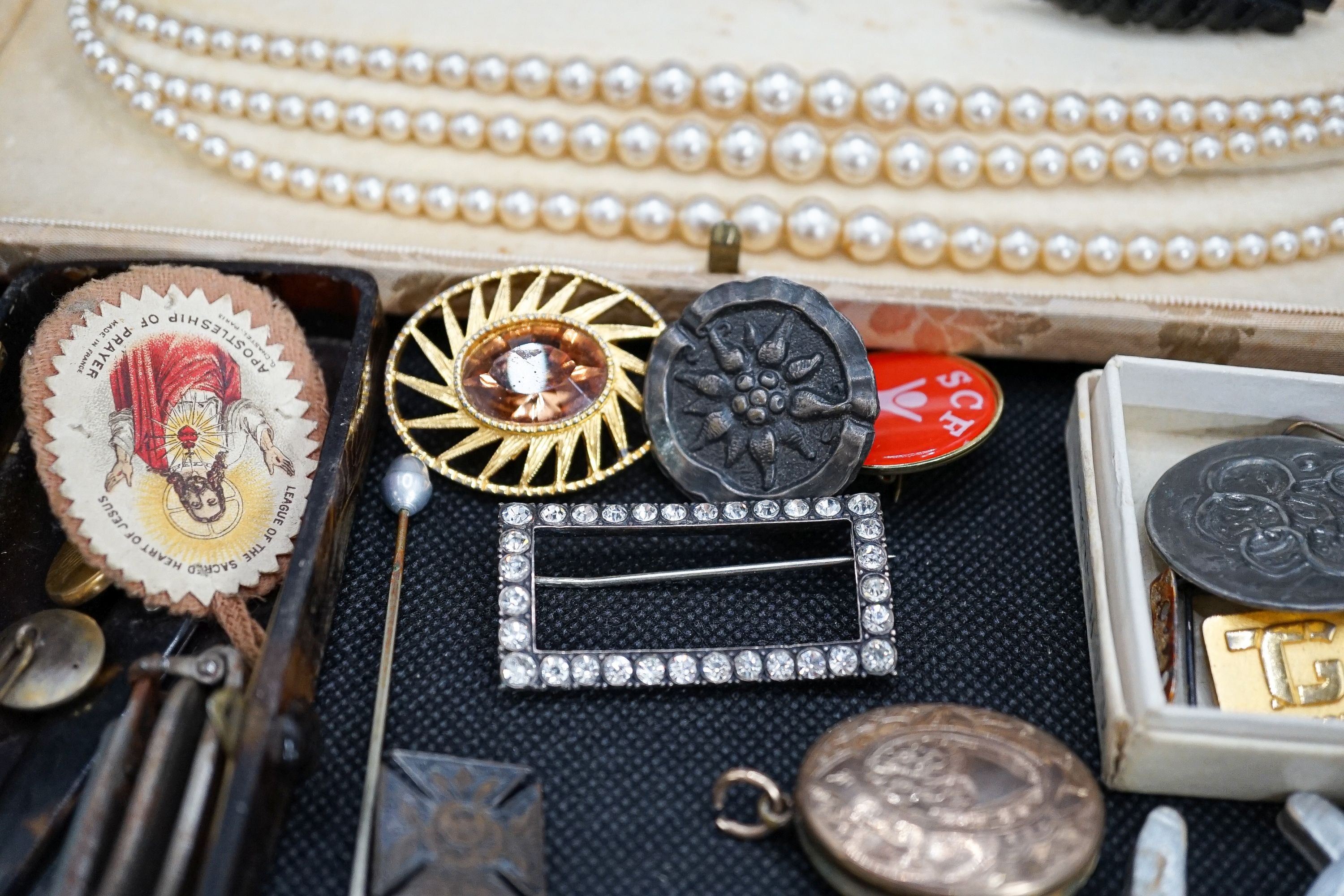 A group of costume jewellery to include a Hermes travelling timepiece.